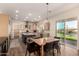 Open floor plan kitchen with stainless steel appliances, a center island, and backyard views at 3408 E Daley Ln, Phoenix, AZ 85050
