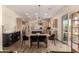 Eat in kitchen features stainless steel appliances, pendant lighting, and wood-look flooring at 3408 E Daley Ln, Phoenix, AZ 85050