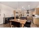 Bright kitchen with stainless steel appliances, a wooden table, and stylish cabinetry at 3408 E Daley Ln, Phoenix, AZ 85050