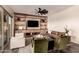 Bright living room with a built-in wall unit, stone accent, and stylish decor at 3408 E Daley Ln, Phoenix, AZ 85050