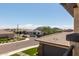 Neighborhood view from balcony showing nearby houses and a mountain in the distance at 3408 E Daley Ln, Phoenix, AZ 85050