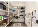 Well-organized pantry with ample shelving, providing optimal storage solutions at 3408 E Daley Ln, Phoenix, AZ 85050