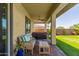 Covered patio featuring a hot tub, comfortable seating, and a ceiling fan for outdoor enjoyment at 3408 E Daley Ln, Phoenix, AZ 85050