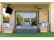 Outdoor living space with a fire pit, cozy seating, and a view of the lush backyard and a covered patio at 3408 E Daley Ln, Phoenix, AZ 85050