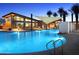 Resort style pool featuring shade sails, adjacent to the building's workout facility at 3408 E Daley Ln, Phoenix, AZ 85050