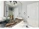 Stylish bathroom featuring a glass vessel sink and modern fixtures at 3641 E Park Ave, Phoenix, AZ 85044