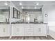 Bathroom showcasing dual vessel sinks, black granite countertops, and modern fixtures at 3641 E Park Ave, Phoenix, AZ 85044