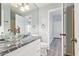 Modern bathroom with a glass vessel sink and sleek black granite countertops at 3641 E Park Ave, Phoenix, AZ 85044