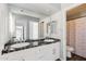 Bathroom featuring double sinks with black marble countertop and white cabinets at 3641 E Park Ave, Phoenix, AZ 85044