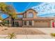 Stunning two-story home featuring a well-manicured front yard, desert landscaping and tile roof at 3641 E Park Ave, Phoenix, AZ 85044