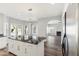 Island featuring modern lighting, black marble countertop, white cabinets, and stainless steel appliances at 3641 E Park Ave, Phoenix, AZ 85044