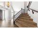 Inviting living room featuring a staircase with wood banister, and hardwood floors at 3641 E Park Ave, Phoenix, AZ 85044