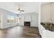 Cozy living room featuring a fireplace, large windows, and a convenient wet bar at 3641 E Park Ave, Phoenix, AZ 85044