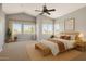 Staged main bedroom showcasing vaulted ceiling, neutral tones, and ample natural light at 3641 E Park Ave, Phoenix, AZ 85044