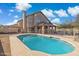 Backyard pool area surrounded by tan concrete and a fence with the home in the background at 3641 E Park Ave, Phoenix, AZ 85044