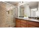 Bathroom featuring double sinks, granite countertop and glass enclosed shower at 3983 E Melinda Dr, Phoenix, AZ 85050