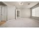 Large bedroom with neutral carpet and view into the hallway at 3983 E Melinda Dr, Phoenix, AZ 85050