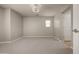 Spacious bedroom with neutral carpet and modern light fixture at 3983 E Melinda Dr, Phoenix, AZ 85050