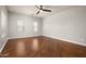 Spacious bedroom featuring hardwood floors and a modern ceiling fan at 3983 E Melinda Dr, Phoenix, AZ 85050