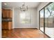 Open-concept dining room with stainless appliances and outdoor patio access at 3983 E Melinda Dr, Phoenix, AZ 85050