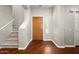 Inviting foyer with wood floors, staircase, and natural light creates a warm and welcoming atmosphere at 3983 E Melinda Dr, Phoenix, AZ 85050
