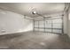Spacious two-car garage with concrete floor and white walls at 3983 E Melinda Dr, Phoenix, AZ 85050