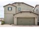 Attached garage with neutral stucco, matching roof and trim, and block paved driveway with low maintenance landscaping at 3983 E Melinda Dr, Phoenix, AZ 85050