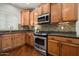 Well-equipped kitchen with stainless appliances and granite countertops at 3983 E Melinda Dr, Phoenix, AZ 85050