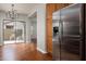 Stainless steel refrigerator in kitchen space with views to patio at 3983 E Melinda Dr, Phoenix, AZ 85050