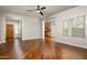 Inviting living room with hardwood floors, opening to kitchen and entryway at 3983 E Melinda Dr, Phoenix, AZ 85050
