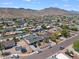 Beautiful aerial view of a neighborhood and home that highlights the desert landscaping and mountain views at 405 W Monte Way, Phoenix, AZ 85041