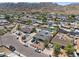 Aerial view of a home nestled in a residential neighborhood, showcasing a pool and surrounding landscape at 405 W Monte Way, Phoenix, AZ 85041