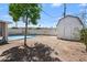 Backyard showcasing the refreshing pool, storage shed, and potential for outdoor activities at 405 W Monte Way, Phoenix, AZ 85041
