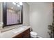 A bathroom with a single sink, granite countertops, and a shower/tub at 405 W Monte Way, Phoenix, AZ 85041