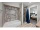 A view of the bathroom, which features a shower and tub at 405 W Monte Way, Phoenix, AZ 85041