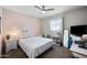 A standard bedroom with a bed, ceiling fan, and standard closet at 405 W Monte Way, Phoenix, AZ 85041
