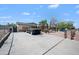 View of the home from behind the gated entrance with desert landscaping and long drive at 405 W Monte Way, Phoenix, AZ 85041