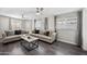 Bright living room featuring neutral decor, modern fan, and plenty of natural light at 405 W Monte Way, Phoenix, AZ 85041