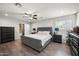 This main bedroom has hardwood floors, ceiling fan, and a bathroom entrance at 405 W Monte Way, Phoenix, AZ 85041
