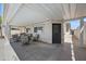 Spacious covered patio featuring neutral outdoor seating, perfect for relaxing and enjoying the backyard at 405 W Monte Way, Phoenix, AZ 85041