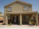 Exterior back of home featuring a covered patio area and a low-maintenance gravel yard at 43241 W Kristal Ln, Maricopa, AZ 85138