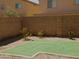 Spacious backyard featuring artificial turf and gravel landscaping, providing a low-maintenance outdoor space at 43241 W Kristal Ln, Maricopa, AZ 85138