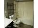 Bathroom with tub/shower, sink with dark vanity and chrome fixtures at 43241 W Kristal Ln, Maricopa, AZ 85138