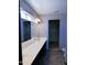 Bathroom featuring a double sink vanity with white countertop and large mirror at 43241 W Kristal Ln, Maricopa, AZ 85138