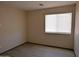 Bright bedroom features a window for natural light and vinyl floors at 43241 W Kristal Ln, Maricopa, AZ 85138