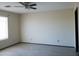 A bright bedroom with a window and ceiling fan at 43241 W Kristal Ln, Maricopa, AZ 85138