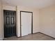 Bright bedroom features a closet and a white sliding door closet at 43241 W Kristal Ln, Maricopa, AZ 85138