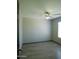 This bedroom has neutral walls, a ceiling fan, a window, and wood-look floors at 43241 W Kristal Ln, Maricopa, AZ 85138