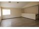 Spacious bonus room with ample natural light and wood-look vinyl flooring at 43241 W Kristal Ln, Maricopa, AZ 85138