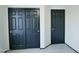 A closet and door with black paint offer space for storage and functionality at 43241 W Kristal Ln, Maricopa, AZ 85138